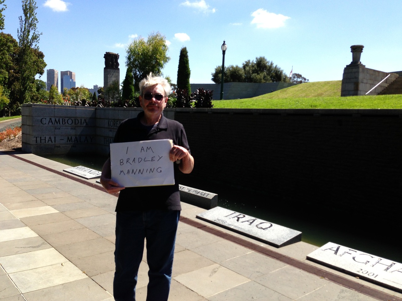 'My name is Tony Harris, retired teacher, journalist and historian from Melbourne Australia, photographed here at the city’s Shrine of Remembrance. Politicians use ceremonies at this memorial to tell lies about war. Bradley Manning reveals the truth.'